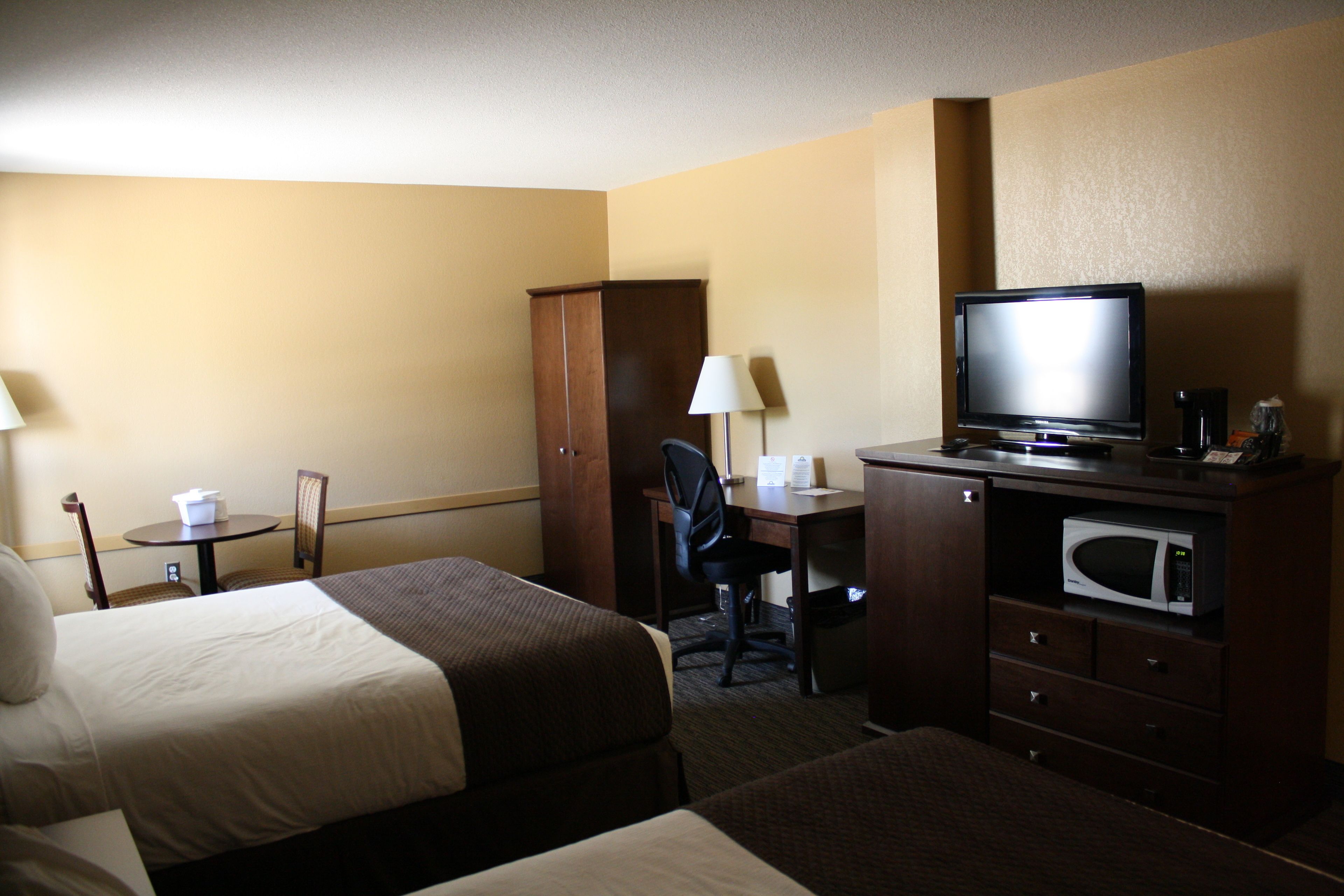 premium bedding, desk, laptop workspace, blackout curtains