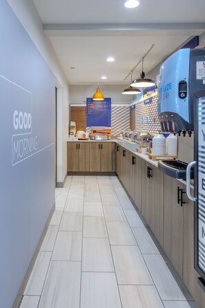 A modern kitchen with a 'GOOD MORNING' sign, a coffee machine, and a 'COFFEE' sign.