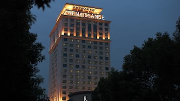 A tall hotel with the name "RENAISSANCE" illuminated at the top.