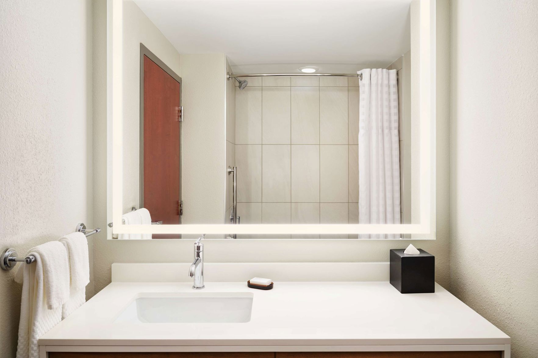 Bathroom | Designer toiletries, hair dryer, towels, soap