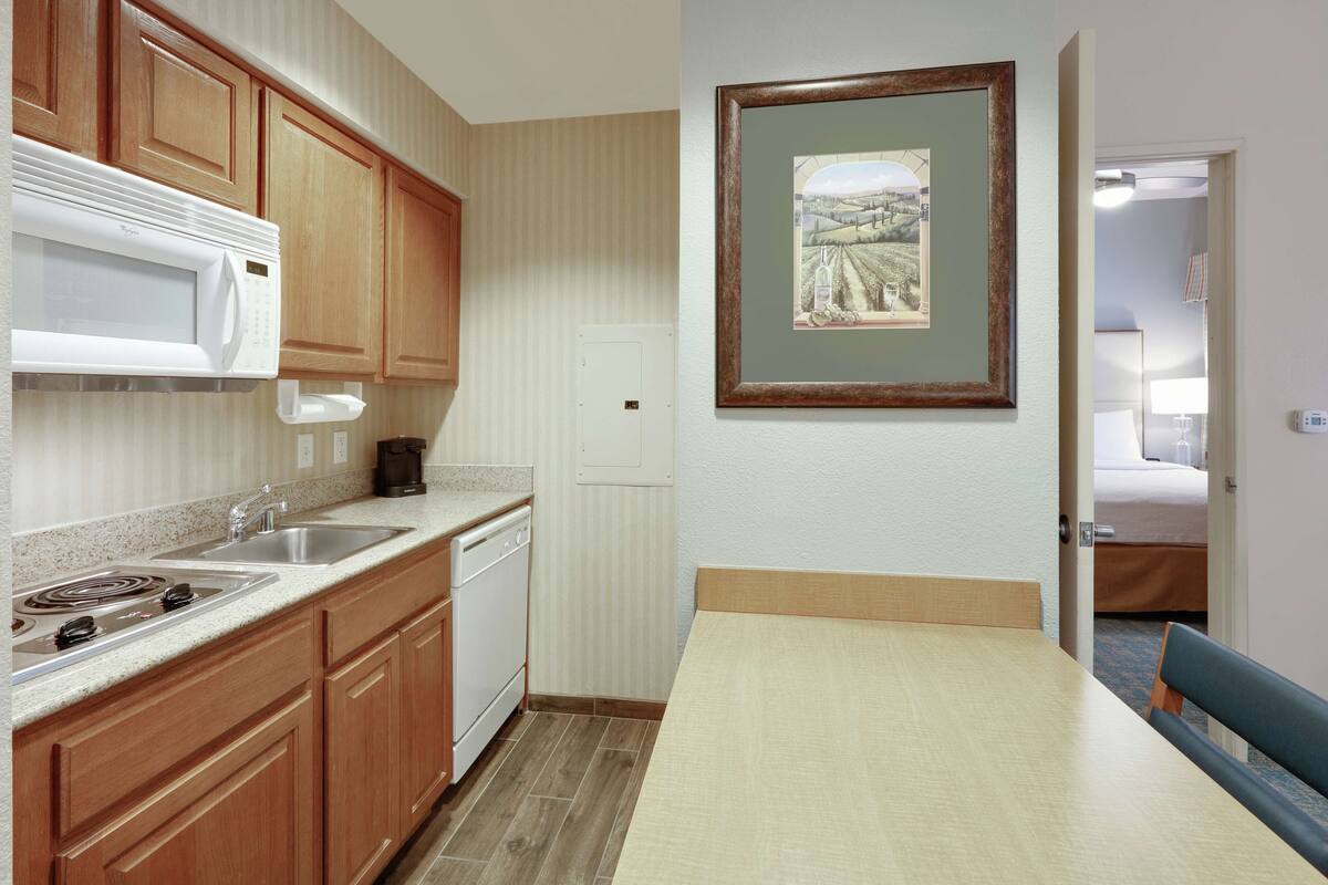 full-sized fridge, microwave, stovetop, dishwasher