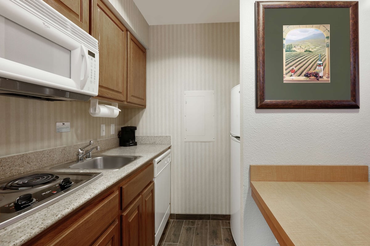 full-sized fridge, microwave, stovetop, dishwasher