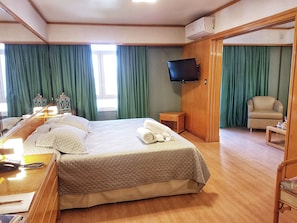 Suíte executiva | 1 quarto, roupas de cama premium, frigobar, cofres nos quartos