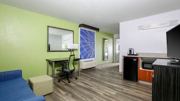 Premium bedding, desk, laptop workspace, blackout drapes