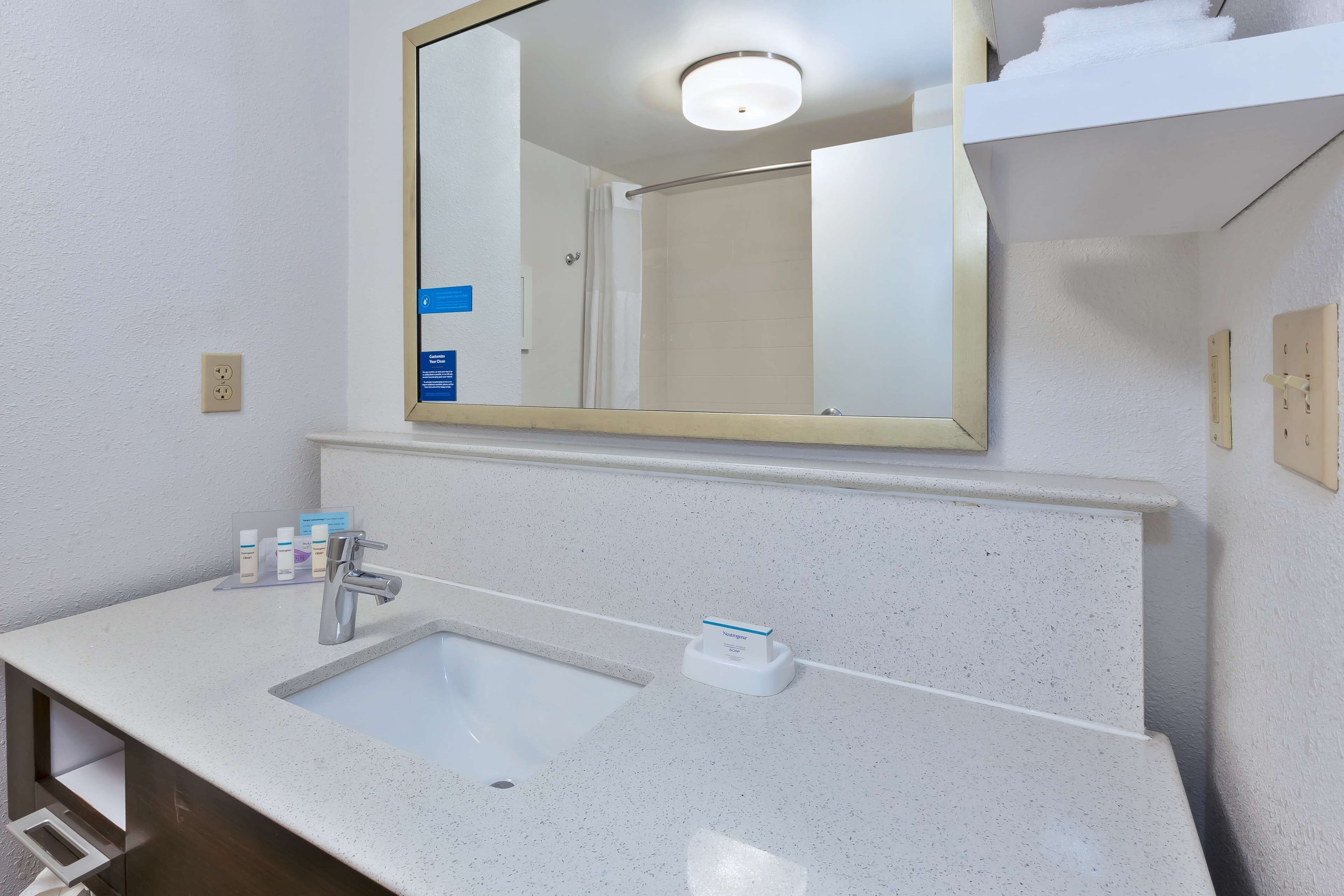 bathtub, hair dryer, towels