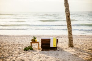 On the beach, white sand, free beach cabanas, sun loungers