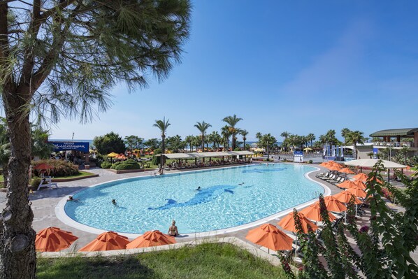2 indoor pools, 3 outdoor pools, open 7:00 AM to 7:30 PM, pool umbrellas