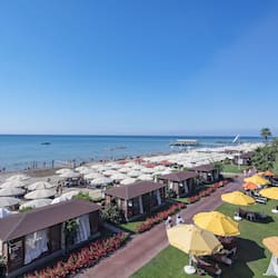 On the beach, sun-loungers, beach umbrellas, beach towels