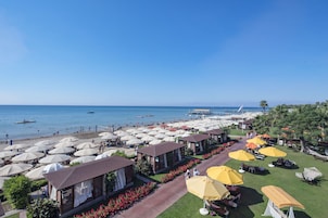 On the beach, sun loungers, beach umbrellas, beach towels