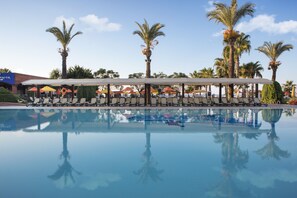 2 indoor pools, 3 outdoor pools, open 7:00 AM to 7:30 PM, pool umbrellas