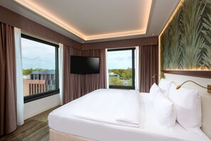 Premium bedding, down comforters, in-room safe, desk