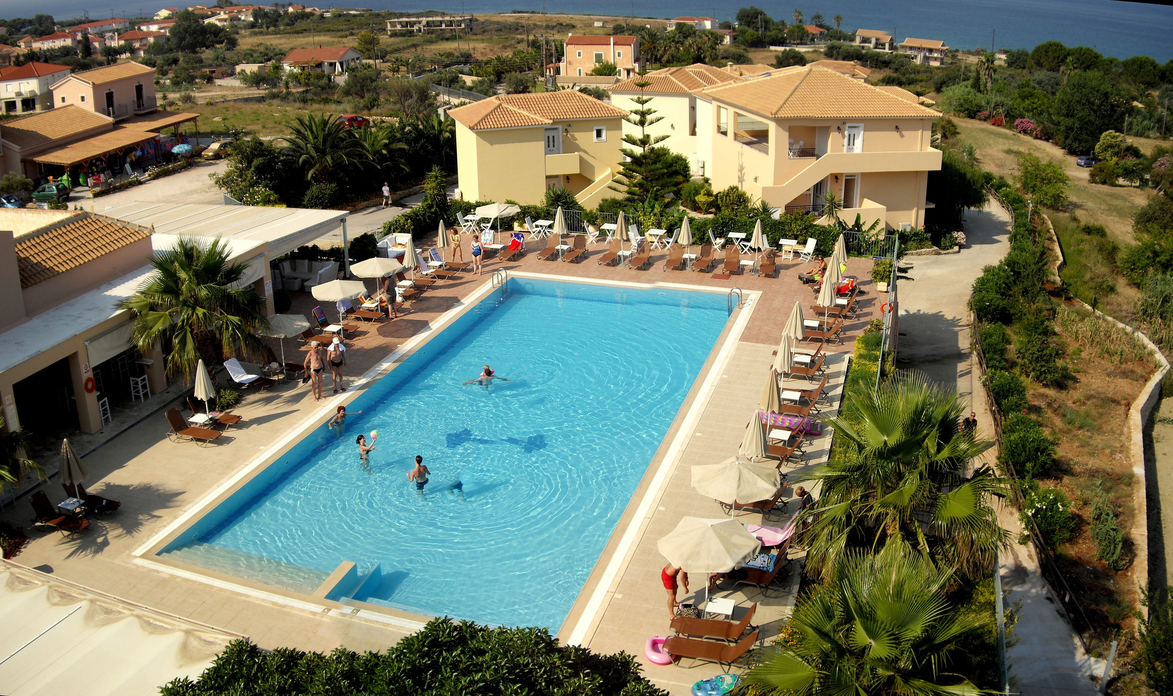 Outdoor pool, open 10:00 AM to 8:00 PM, pool umbrellas, sun loungers