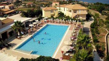 Outdoor pool, open 10:00 AM to 8:00 PM, pool umbrellas, pool loungers