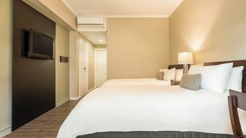 Family Room, 2 Double Beds | Minibar, in-room safe, individually decorated, individually furnished