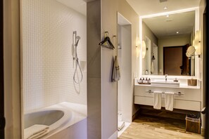 Shower, designer toiletries, hair dryer, bathrobes