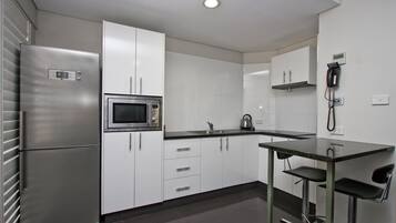 Full-size fridge, microwave, coffee/tea maker, electric kettle