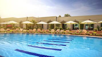 2 outdoor pools, open 6:00 AM to 9:30 PM, pool umbrellas, pool loungers