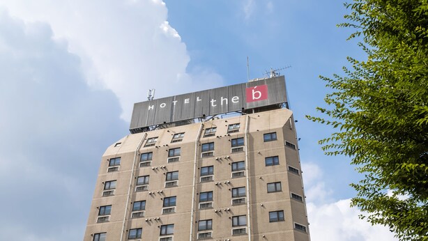 A hotel building with a sign reading "HOTEL the b" on the top. - the b sangenjaya (Tokyo)