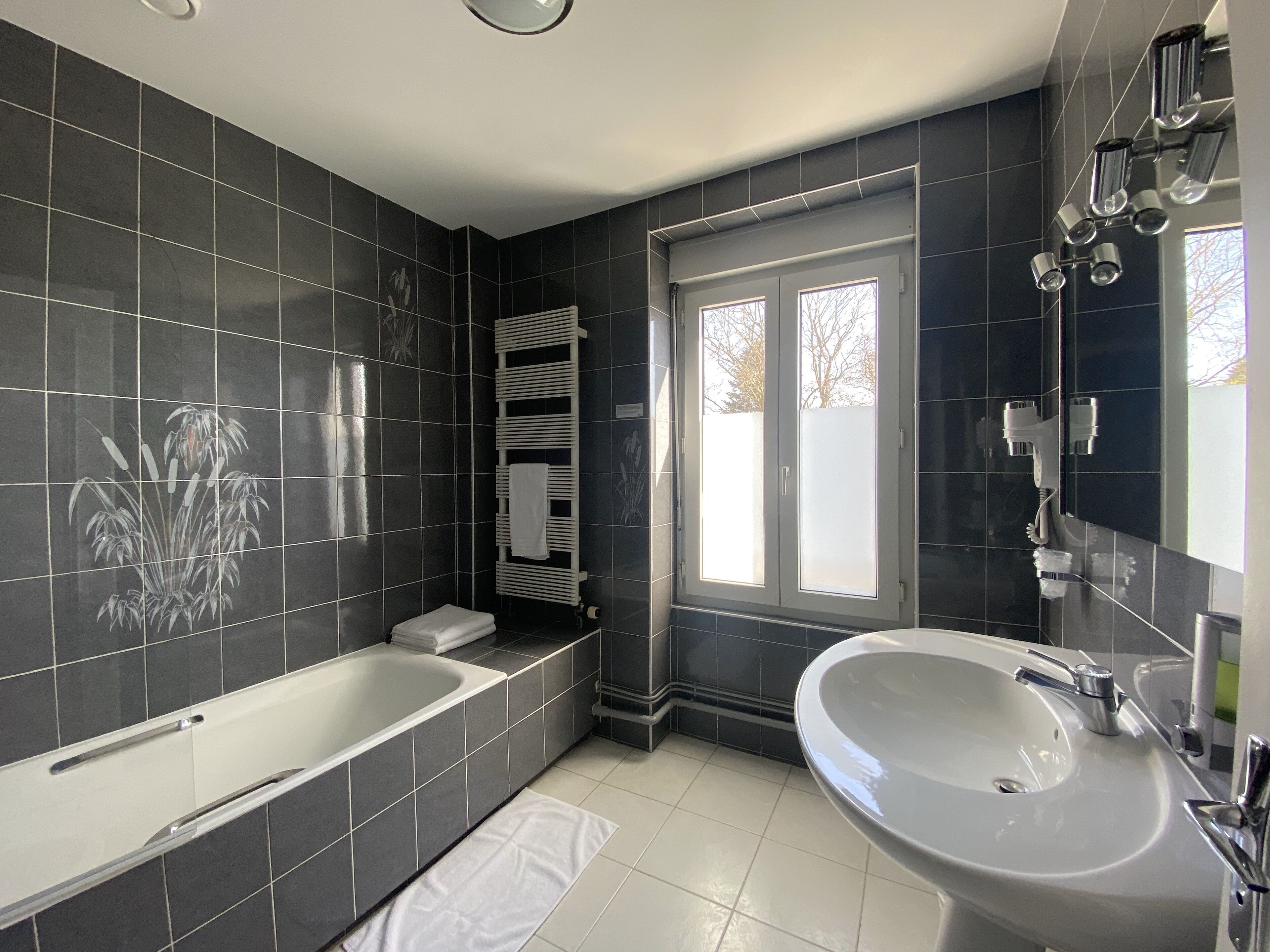 superior triple room | bathroom | towels, soap, shampoo, toilet paper