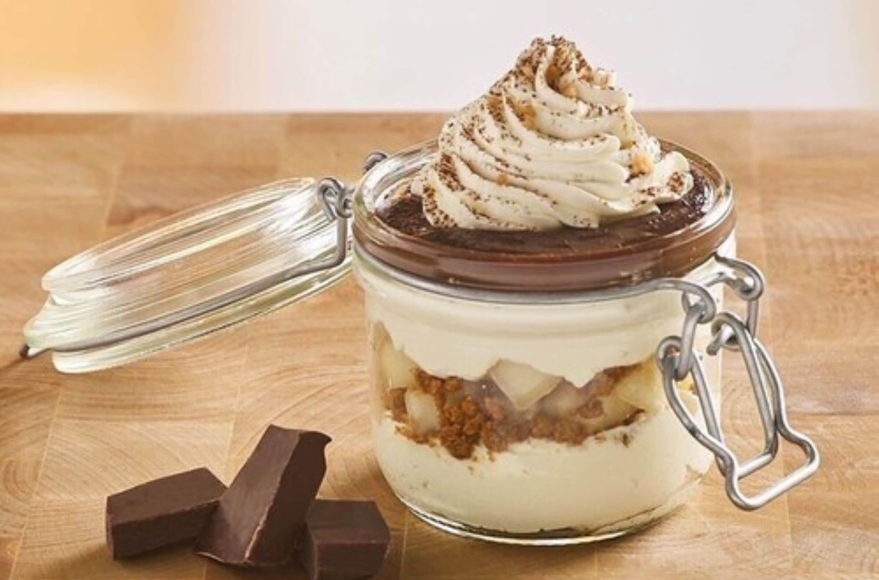 A dessert in a glass jar with a metal clasp lid.