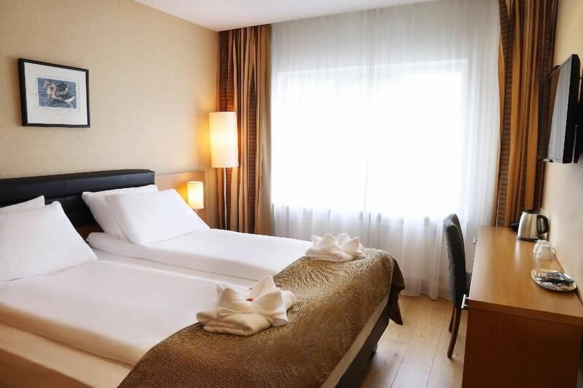 Hypo-allergenic bedding available, in-room safe, blackout drapes