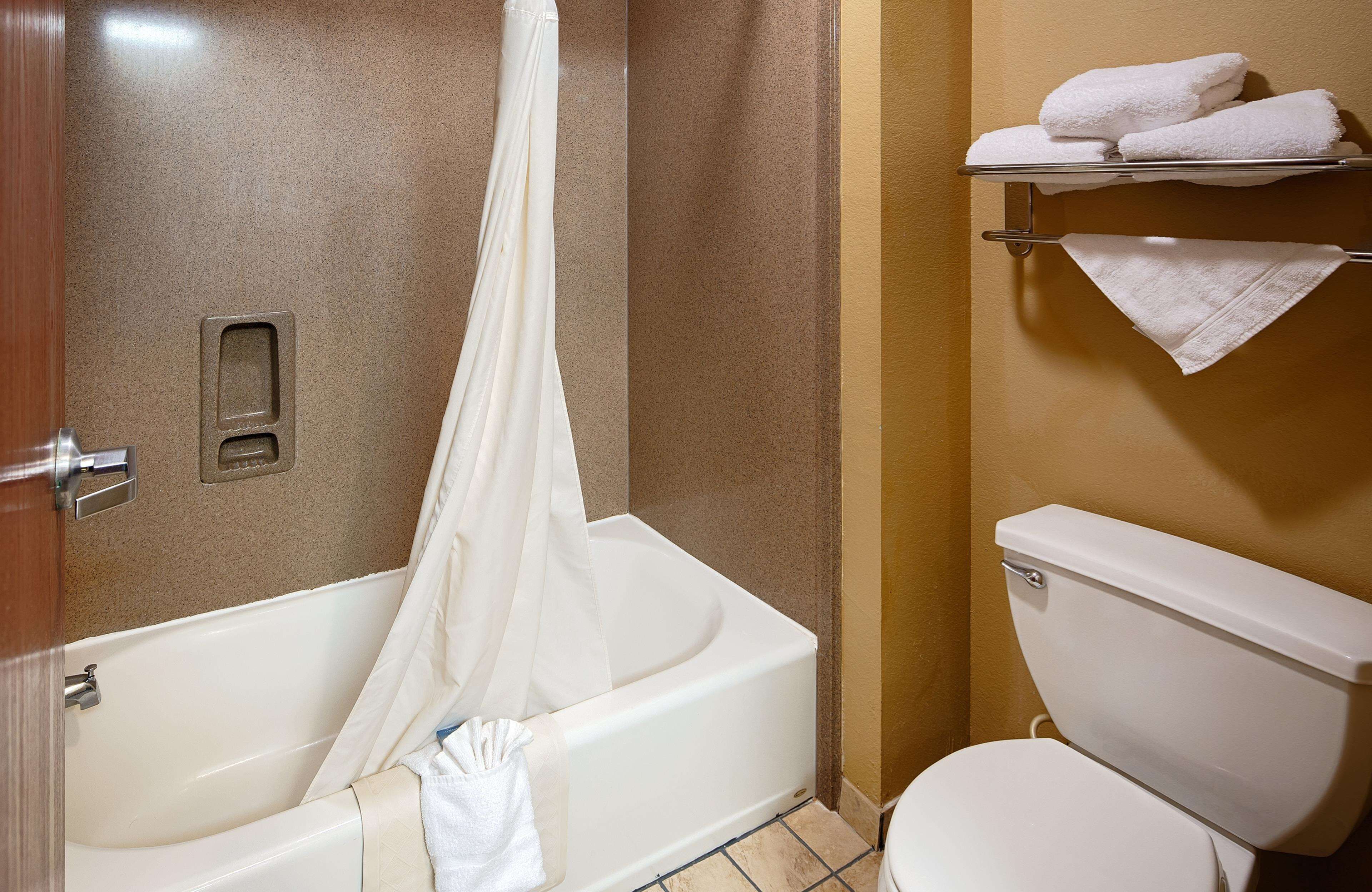 Bathtub, hair dryer, towels