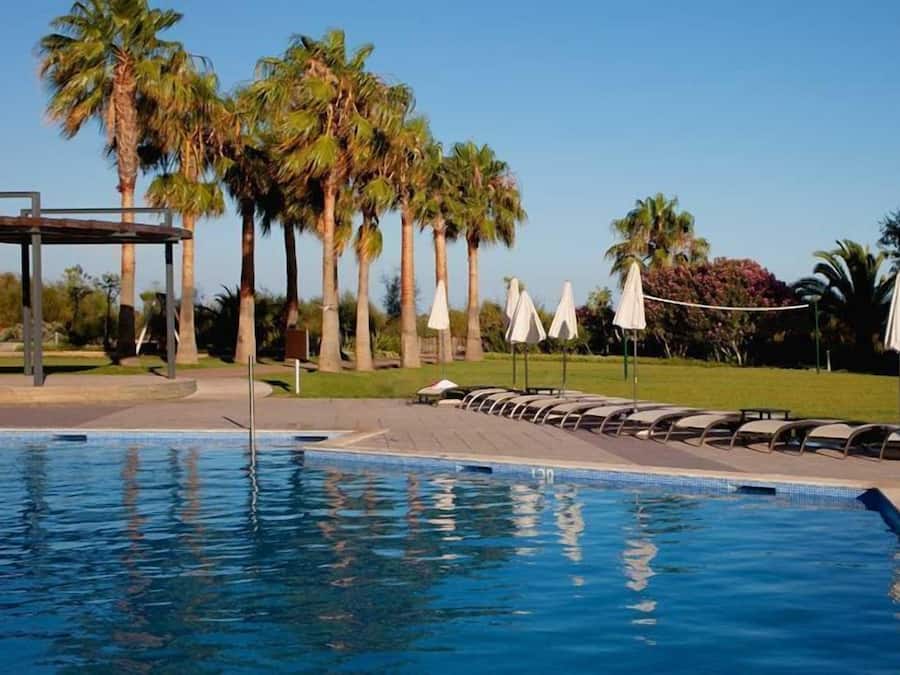 Indoor pool, outdoor pool, pool umbrellas, pool loungers