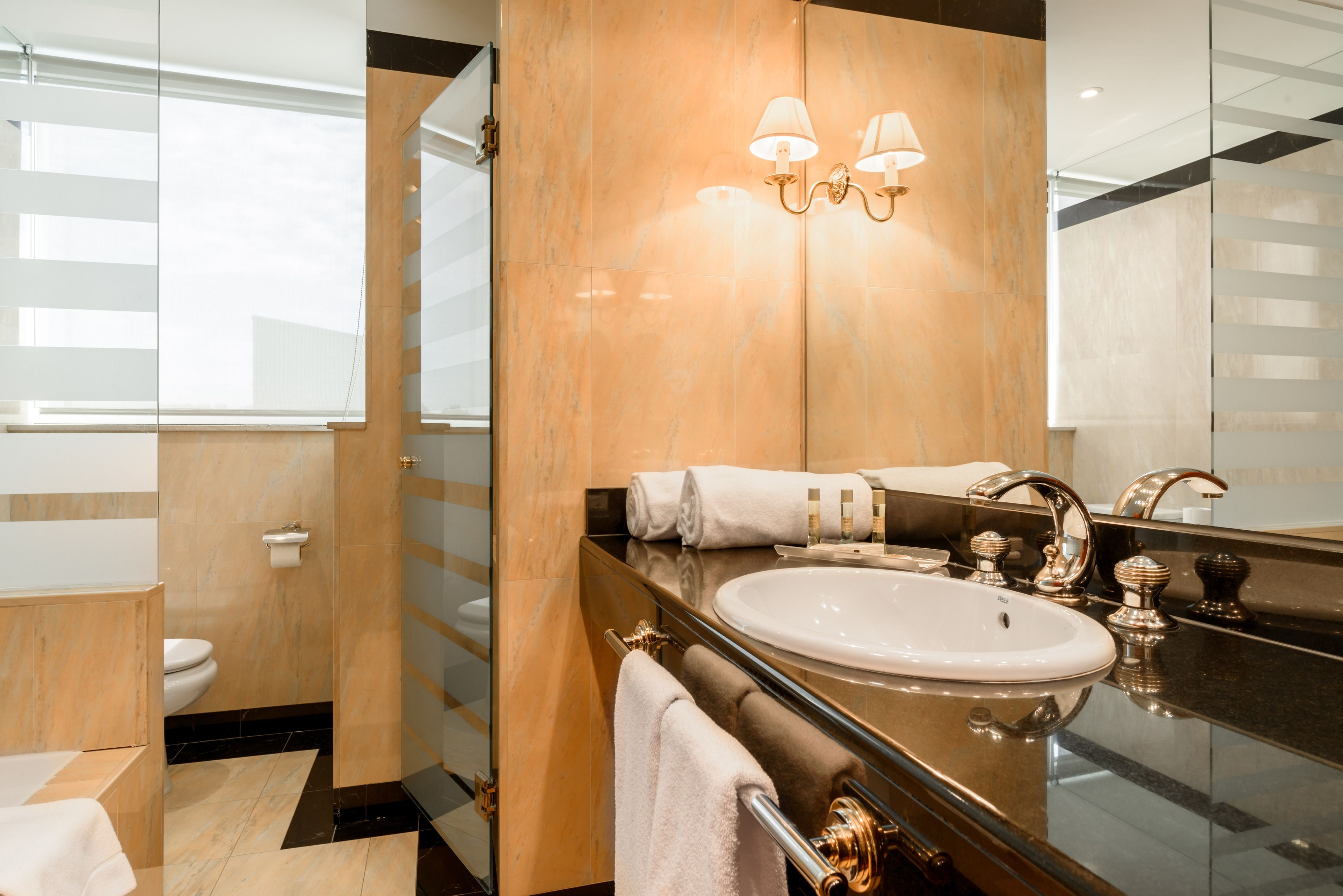 bathtub, eco-friendly toiletries, hair dryer, towels