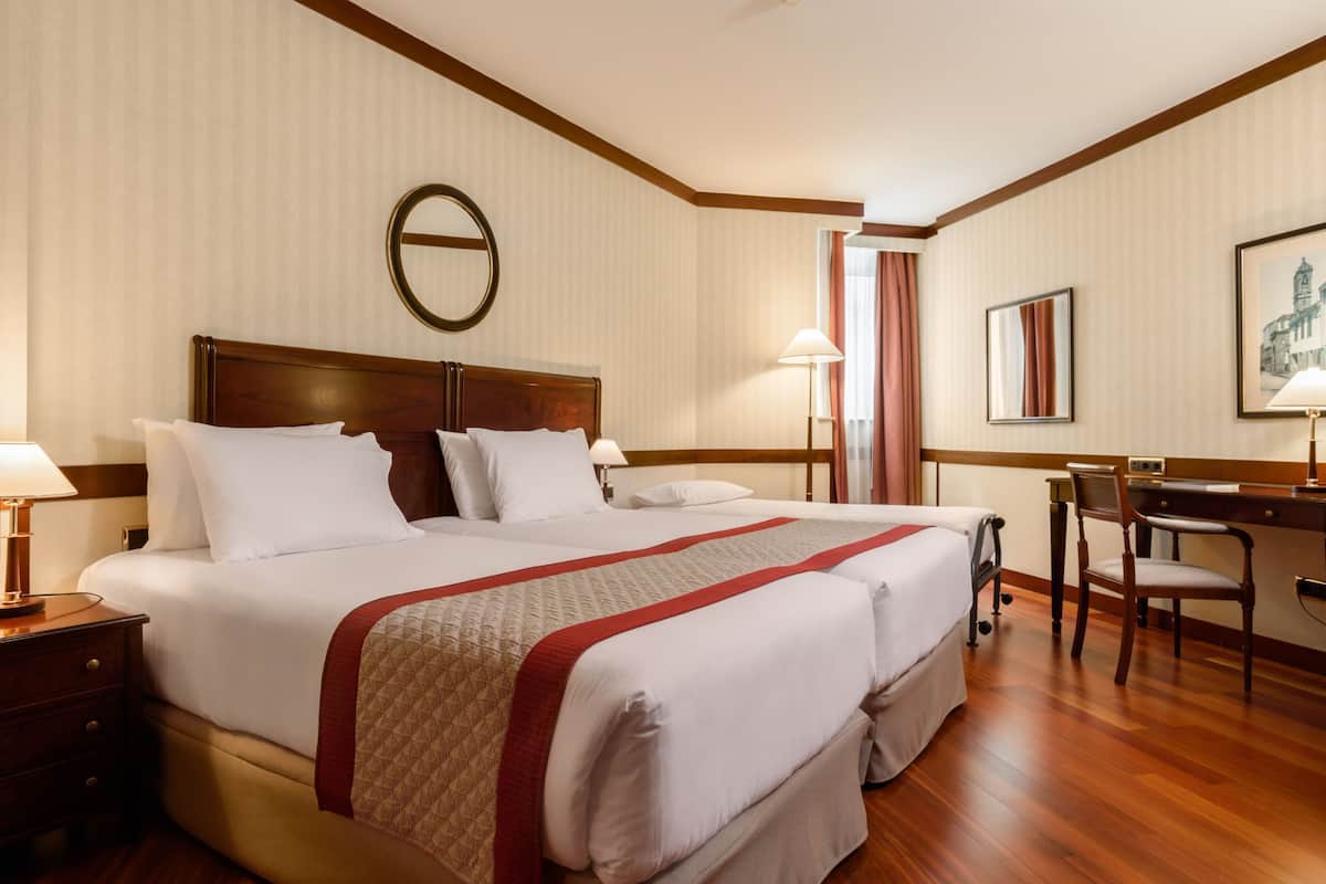 Free minibar items, in-room safe, desk, laptop workspace