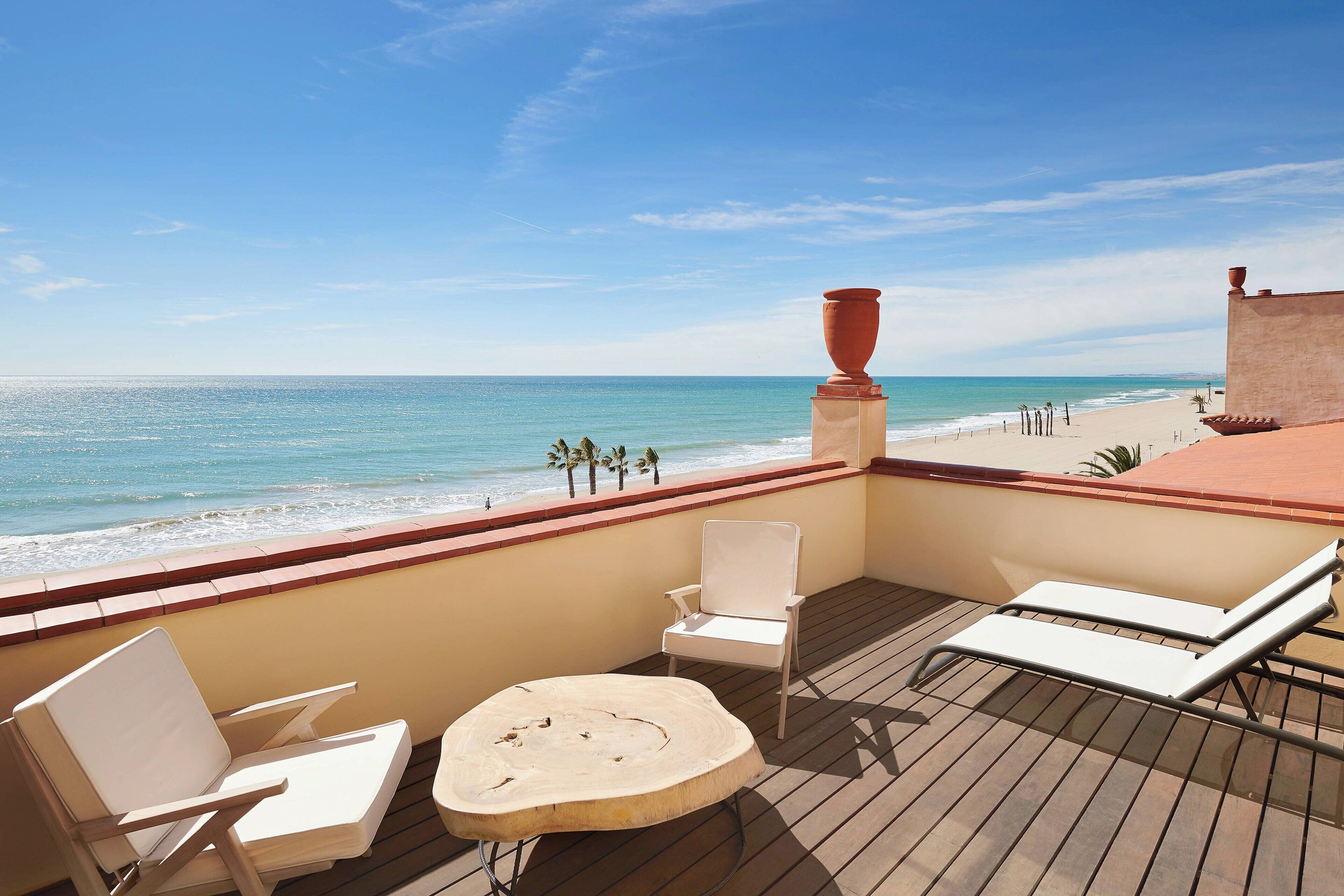Grand Room, 1 King Bed, Beachfront | Beach | On the beach, white sand, beach umbrellas, beach towels
