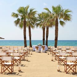 On the beach, white sand, beach umbrellas, beach towels