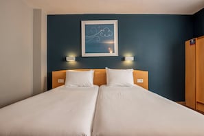 Desk, blackout curtains, free WiFi, bed sheets