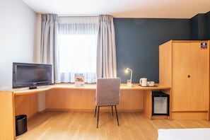 Desk, blackout curtains, free WiFi, bed sheets