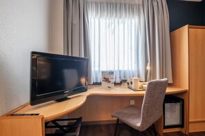 Desk, blackout curtains, free WiFi, bed sheets