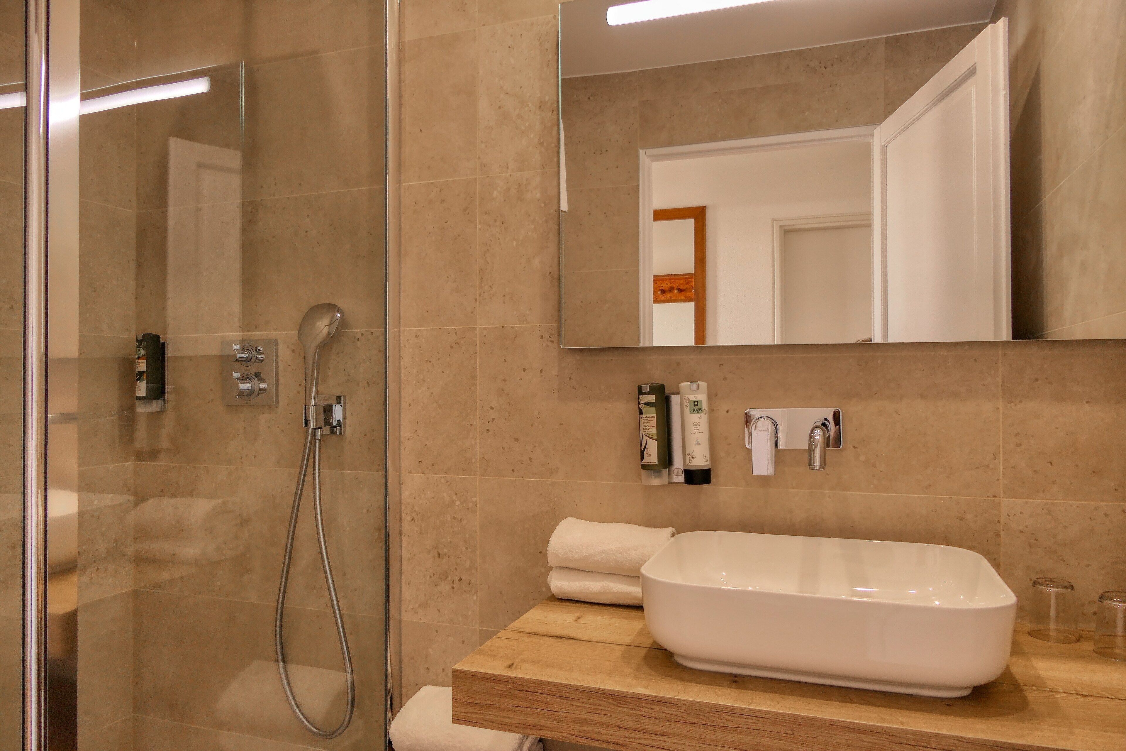 shower, free toiletries, hair dryer, towels