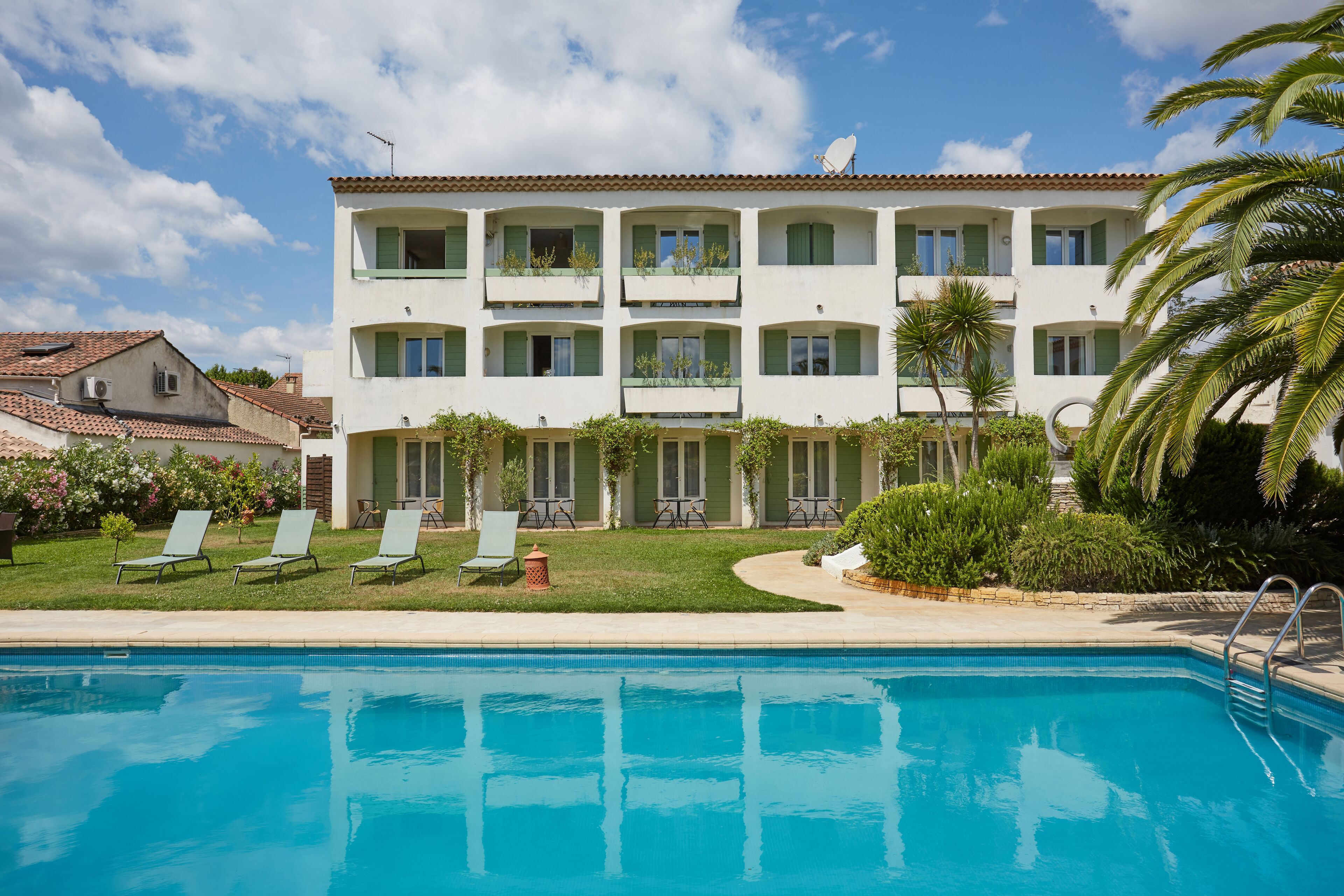 Seasonal outdoor pool, open 9:00 AM to 8:00 PM, pool umbrellas