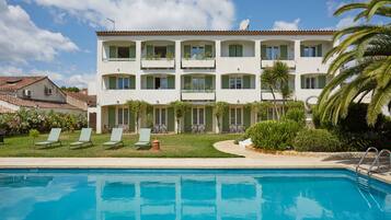 Seasonal outdoor pool, open 9:00 AM to 8:00 PM, pool umbrellas