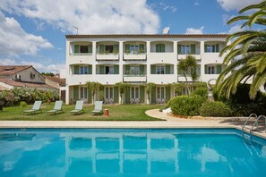 Seasonal outdoor pool, open 9:00 AM to 8:00 PM, pool umbrellas