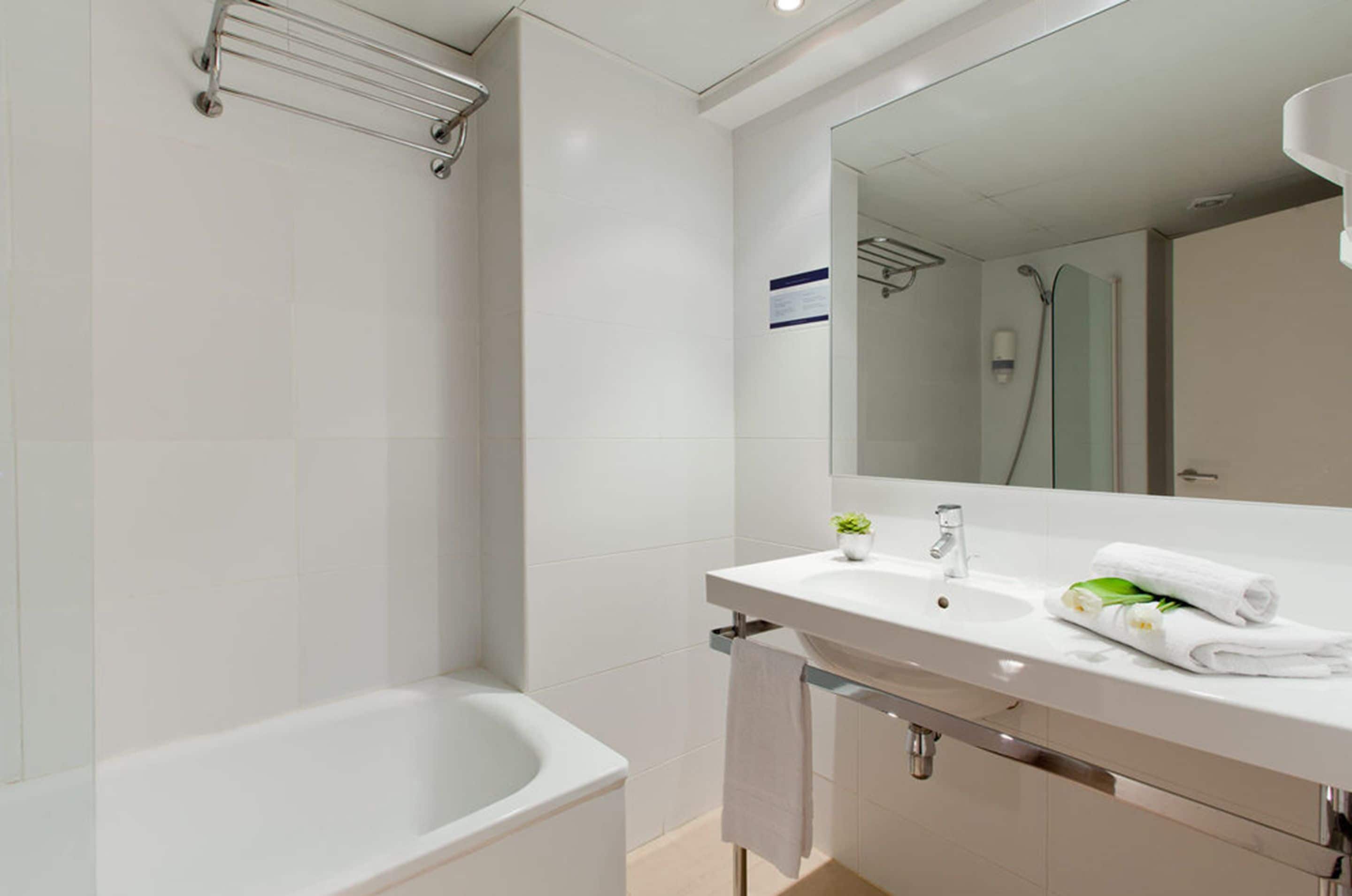 eco-friendly toiletries, hair dryer, towels