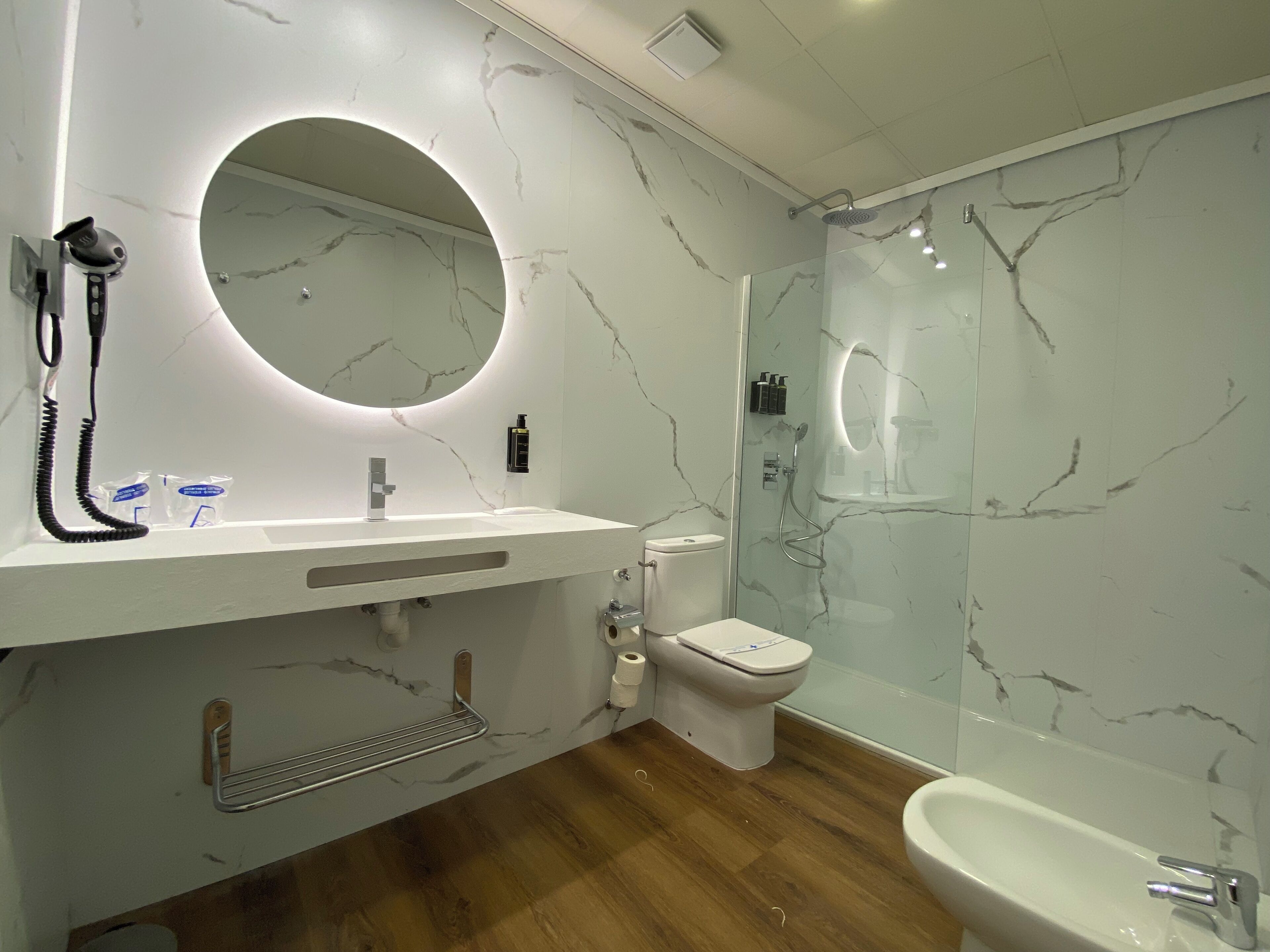 designer toiletries, hair dryer, bathrobes, bidet