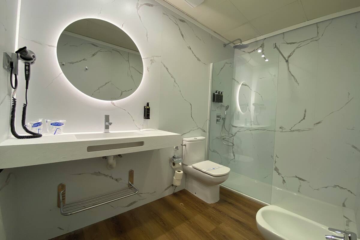 designer toiletries, hair dryer, bathrobes, bidet