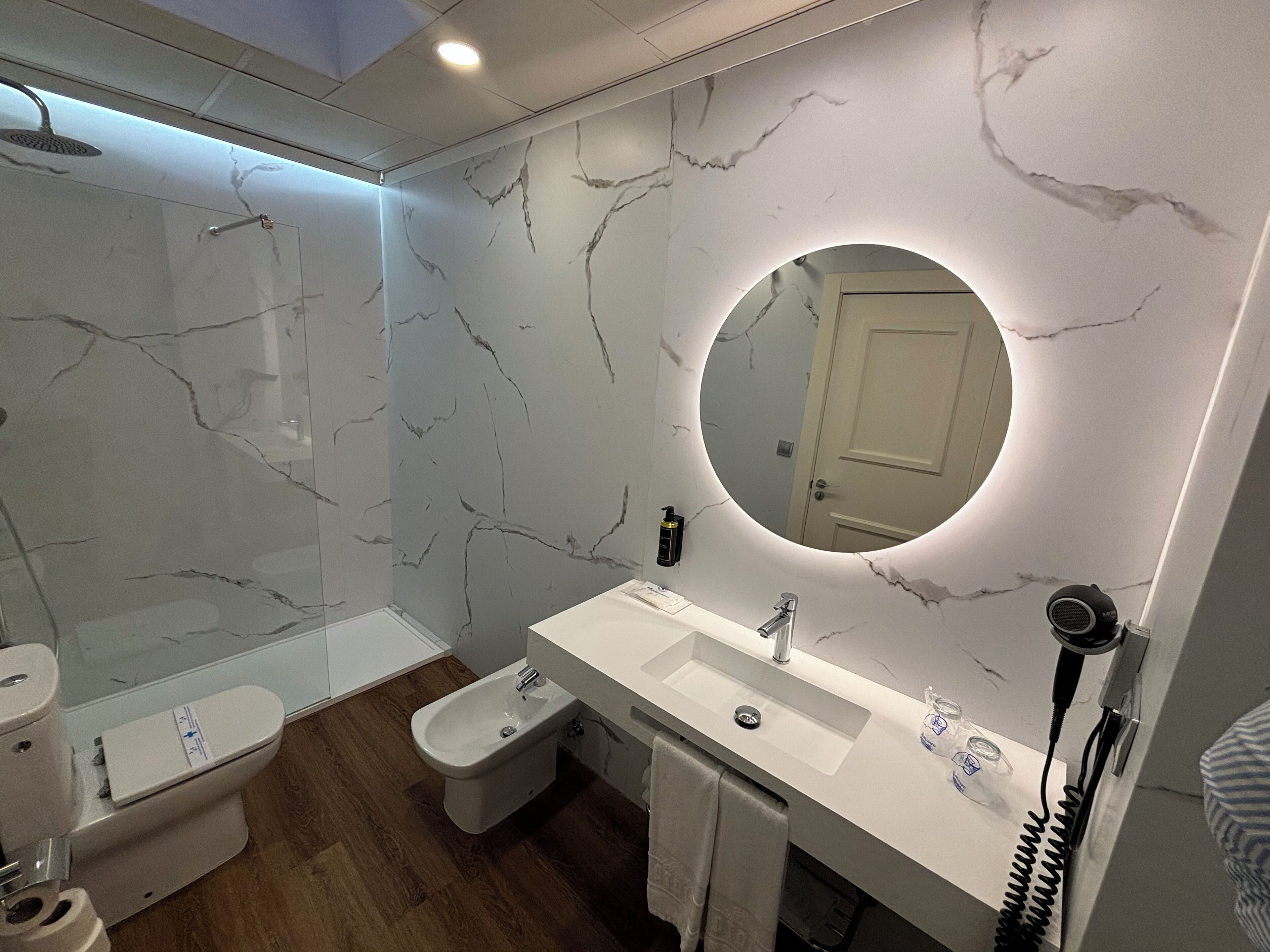 designer toiletries, hair dryer, bathrobes, bidet