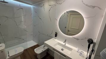 Designer toiletries, hair dryer, bathrobes, bidet