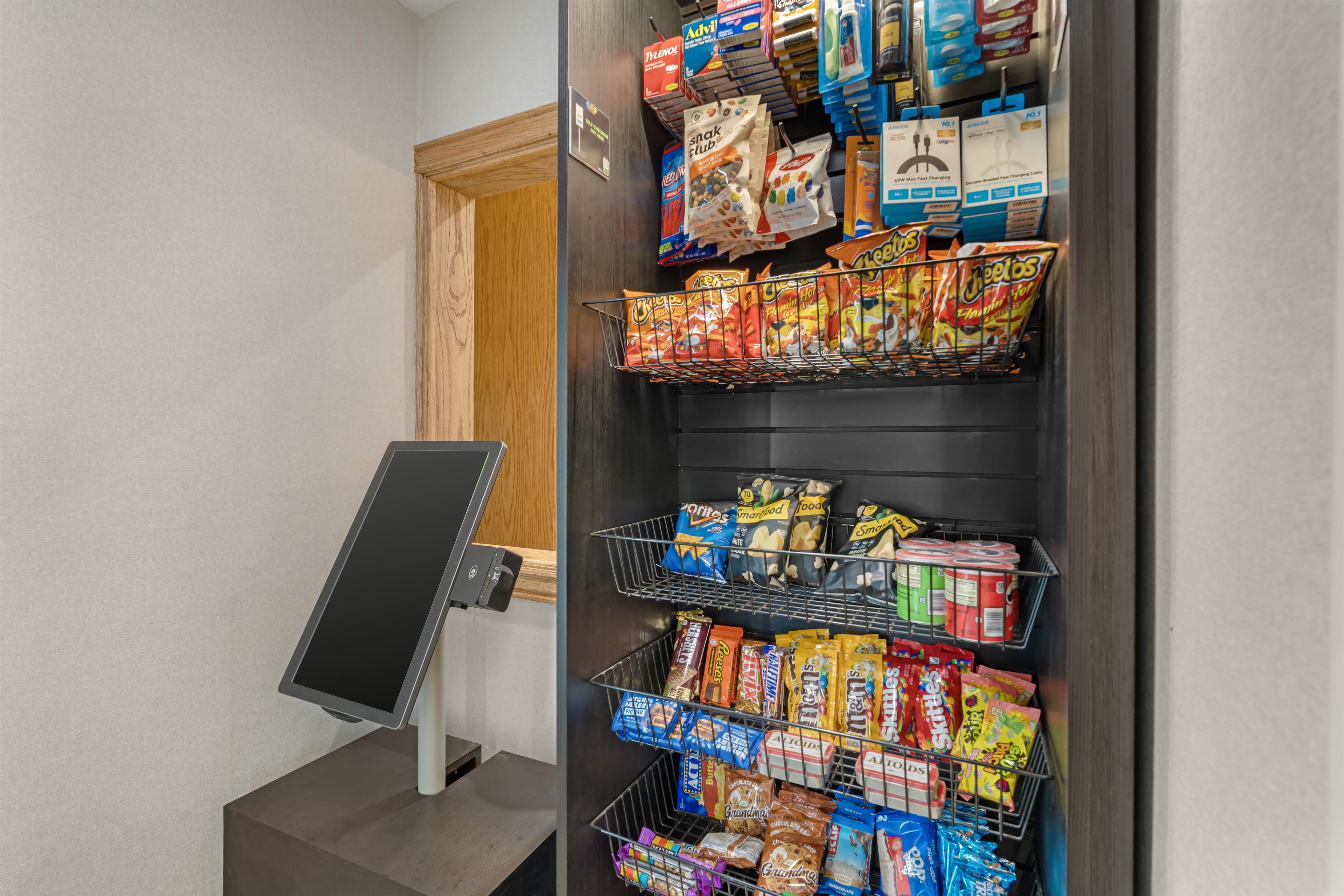 A self-service kiosk with snacks and beverages.
