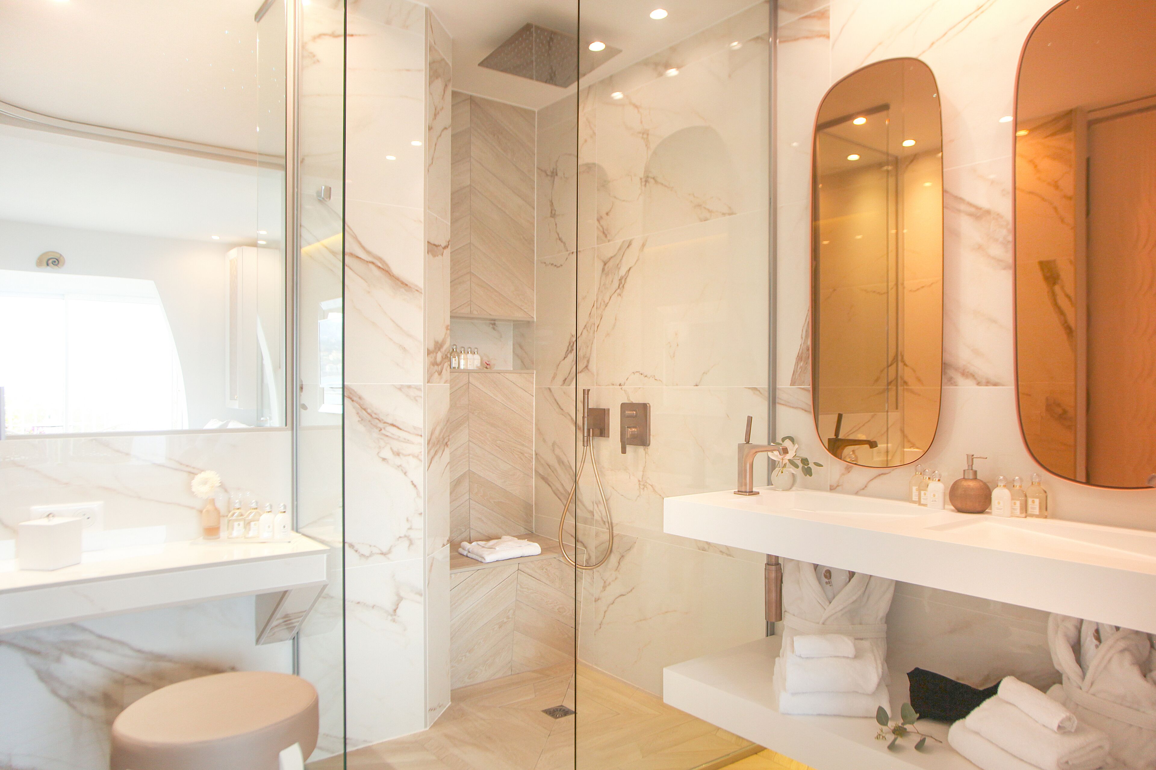 separate bathtub and shower, rainfall showerhead, designer toiletries