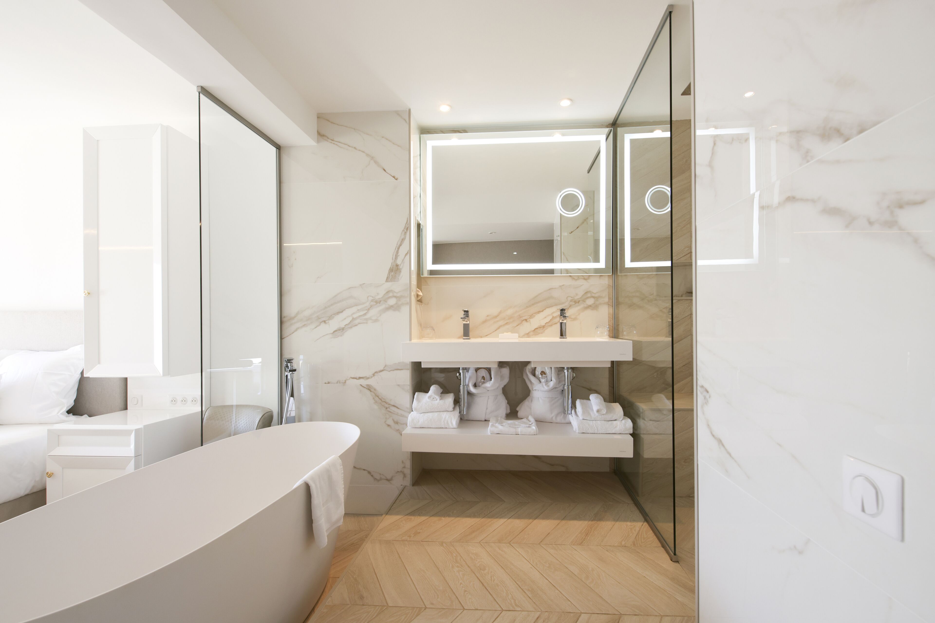 junior double room | bathroom | separate bathtub and shower, rainfall showerhead, designer toiletries