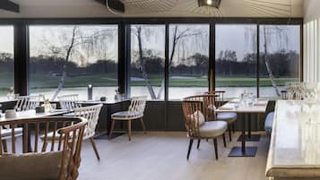 Breakfast, lunch, dinner served; French cuisine, golf course views