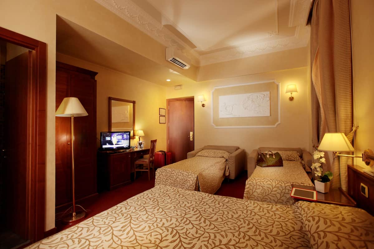 Family Room | Premium bedding, down comforters, in-room safe, desk