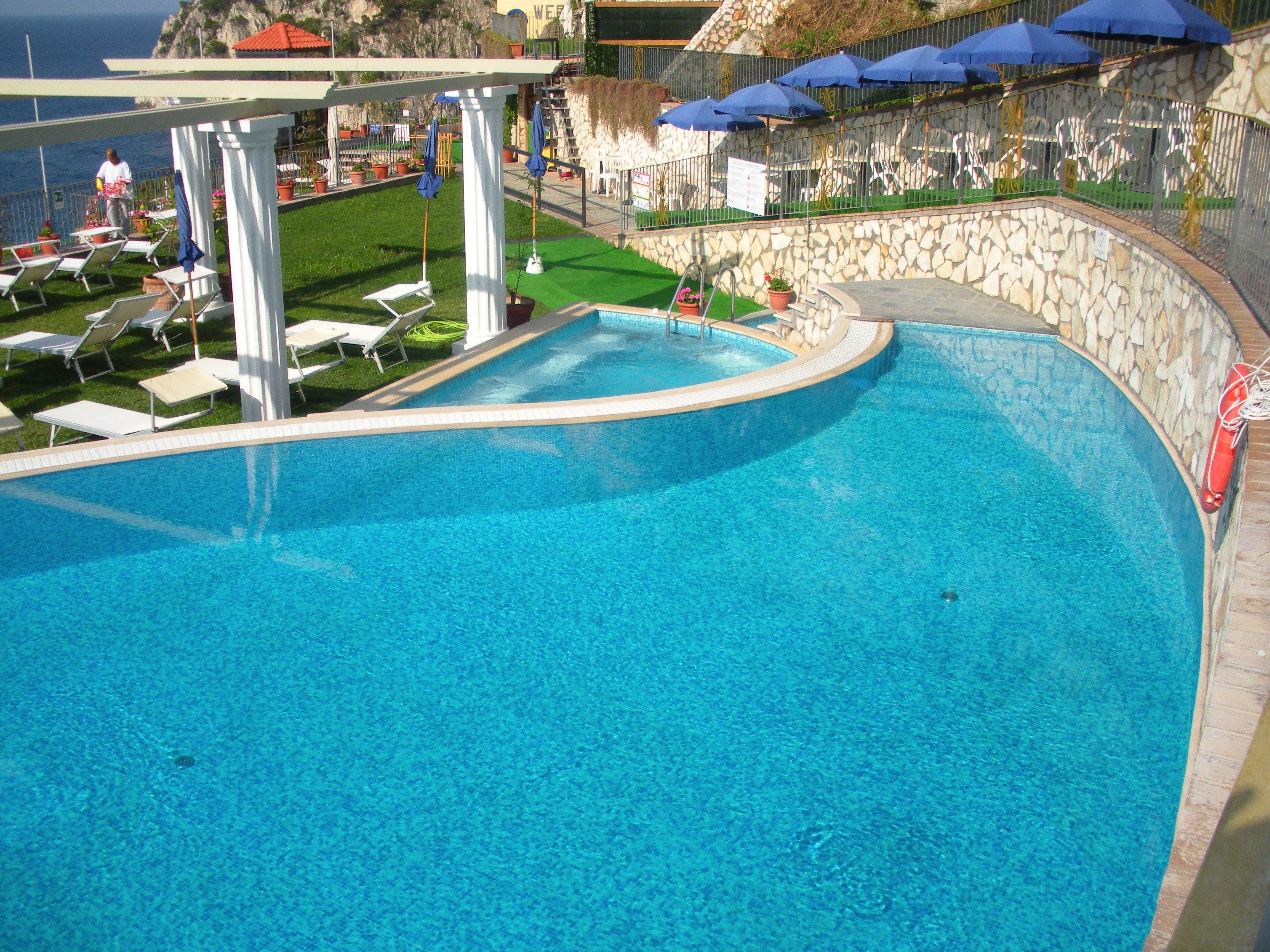 outdoor pool, pool umbrellas, pool loungers