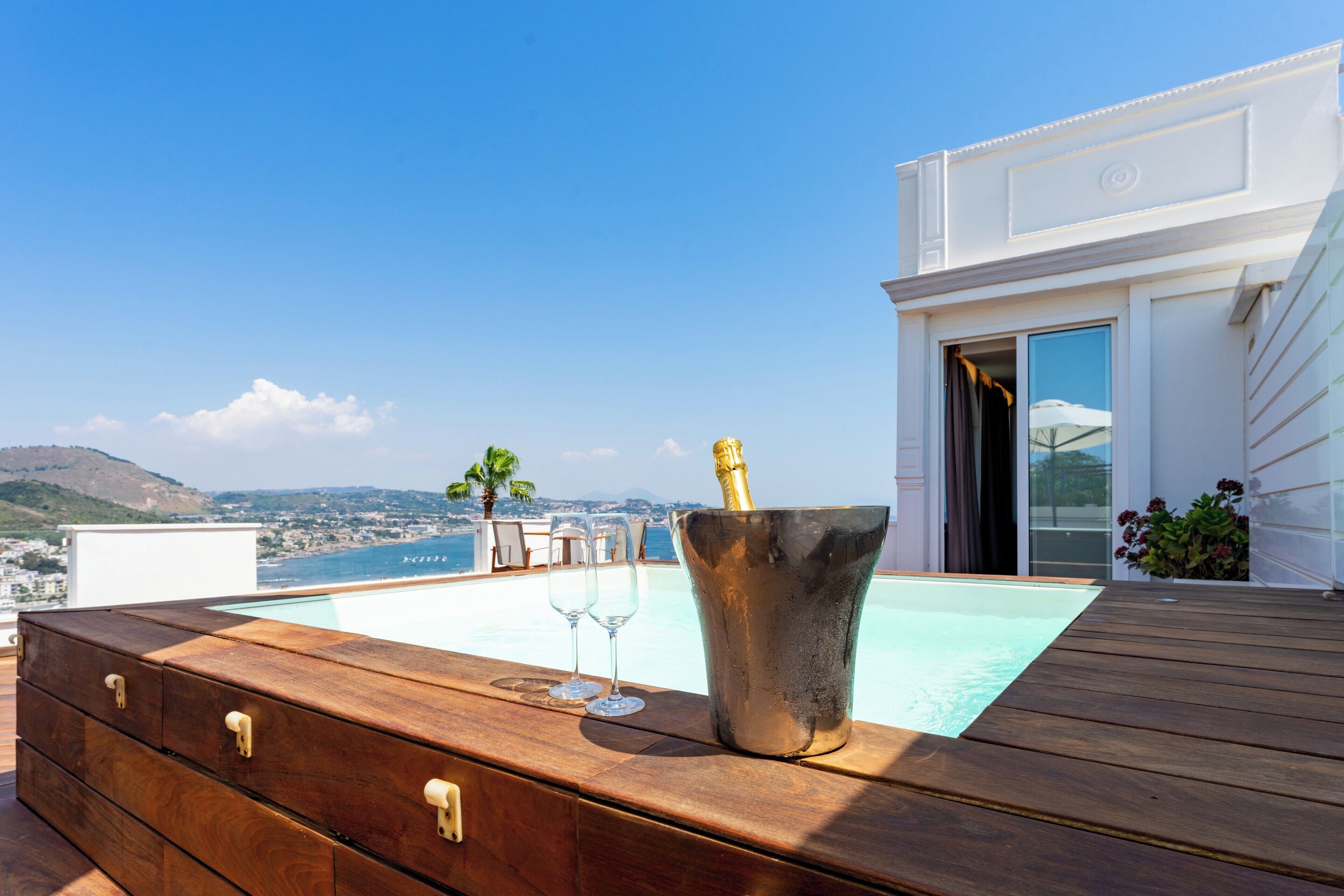 deluxe suite, hot tub, sea view | terrace/patio
